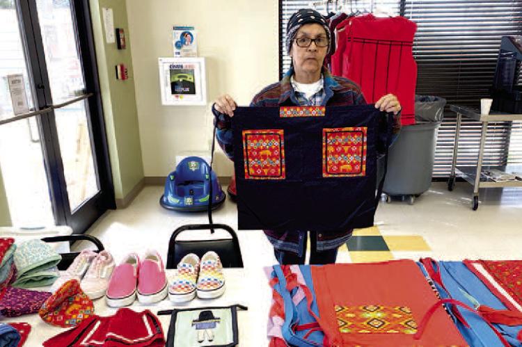 WETUMKA INDIAN COMMUNITY HELD ANNUAL SPRING BIZZARE LAST WEEK. One of the many talented exhibitors was Phyllis Noon, pictured above with several of her homemade items. These items are unique, one-of-a-kind, pieces of art. They cannot be found anywhere else in the world.