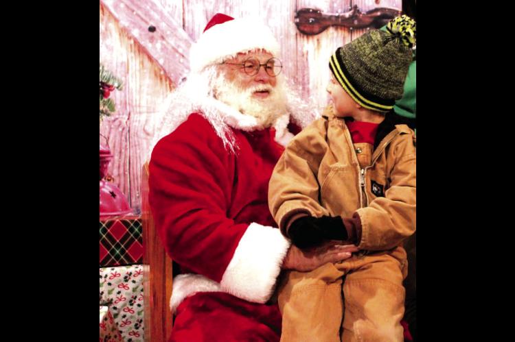 I DON’T CARE WHAT YOU HEARD, SANTA, I HAVE BEEN A GOOD BOY ALL YEAR...Asa Alexander tells Santa what he hopes to get for Christmas this year. The Town of Calvin hosted Santa and his elf at the Christmas parade this year. The Christmas story was read, fl