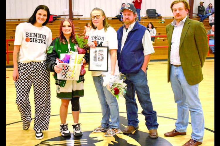 Senior Destiny Smith was escorted by her parents, Terrae and Paul Smith and sister Shirrae Duncan. Girls coach Brandon Kirkpatrick made the presentation.