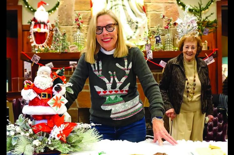 Seminole Nation Museum board president Barbara Butner and docent Phyllis Williamson man the refreshment table at the 2023 Holiday Bazaar. The Bazaar kicks off the holiday season in Wewoka and fills the museum with the Spirit of Christmas as the aroma of freshly made baked goods and sweets fills the air, lively carols and Christmas tunes ring throughout the building, and people crowd the galleries seeking perfect gifts to put under their trees, or that “just what I need” buy for themselves.