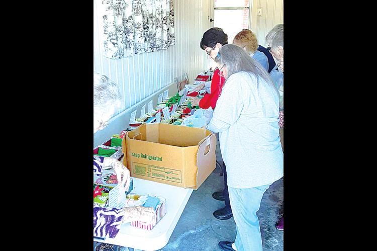 Community Angels prepare Christmas boxes