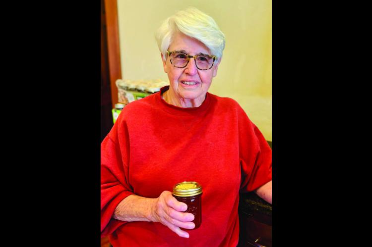 Phyllis Houser shows one of the 90 jars of homemade jams and jellies she is donating to the Seminole Nation Museum’s 52nd Annual Holiday Bazaar, set for Friday, Nov. 21, at the museum in Wewoka. A long-time supporter of the fundraiser, Houser has been b