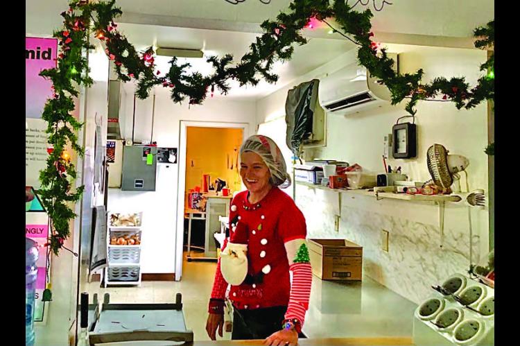 WETUMKA SENIOR CENTER’S NEW HEAD COOK, Tracy Hughes, decked out in her smartest Christmas fine.r y Photo Courtesy of Byron Tapley