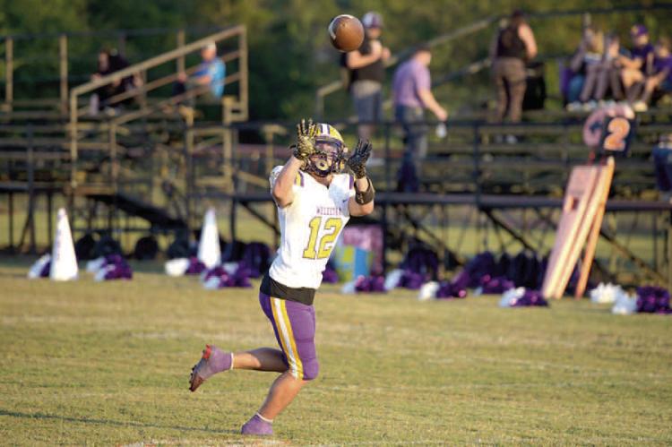 Paul Lowery catches a dart from Quarterback Isaiah Drake