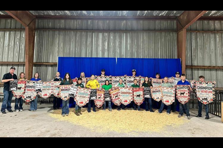 HUGHES COUNTY JUNIOR LIVESTOCK SHOW Pictured are many of the banner winners from the Moss 4H &amp; FFA Show Team at the Hughes County Junior Livestock Show Premium Sale held on Tuesday, Feb 25, 2025. Front row: Cierra Wood, Samuel Pipkin, Jaxi Long, Lexi 