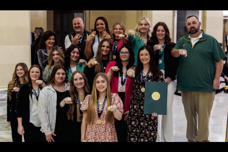 Members of the Stuart High School Lady Hornets Fastpitch Softball team and Head Coach Jeff Parnell and Assistant Coach Rodney Treat show off their 2024 OSSAA Class B State Championship rings at the State Capitol. They were recognized on the House floor by