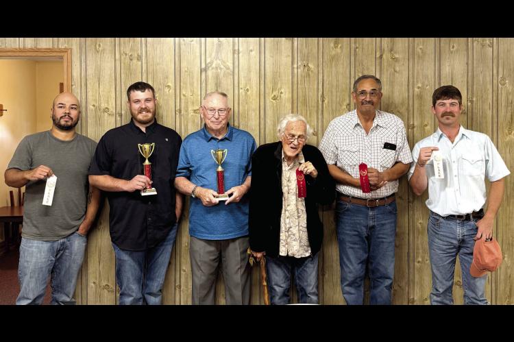 Lamar First Baptist Church celebrated their annual cake bake off. Awarded trophies to first places and ribbons to second and third places. Contestants pictured left to right are Larry Smith, Trevor Carpenter, Claude Butler, Tom Simmons, Darrell Shields and Broderic Ford. Trevor Carpenter won first place for the best tasting cake and Claude Butler won first place for best looking cake.