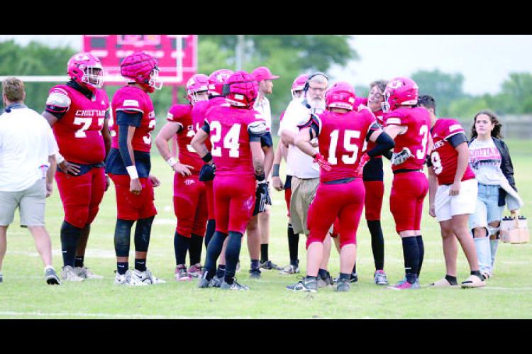 Coach Reid addresses the Chieftains during huddle