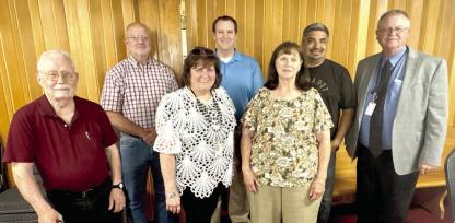 WETUMKA CHAMBER HOSTS MONTHLY LUNCHEON... Community leaders and guests gathered for a delicious lunch provided by Jesse Lopez and his new pizza venture. Pictured above are Chamber Board Members (L-R): Vernon Stout, Vic Woods, Donna Dyer, James Berry II, Debbie McDaniel, Jesse Lopez and Steve Stewart.