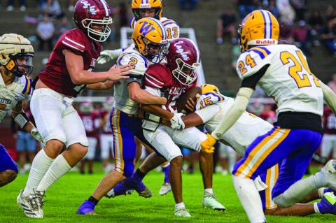 Isaiah Drake and Kellen Sheneman combine for the tackle.