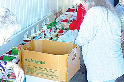 Community Angels prepare Christmas boxes