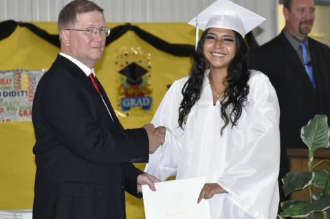 Graham-Dustin seniors receive diploma from Robert Holt, School Board President
