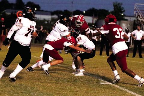 Bradyn Young, Kylar Gordon and Phillip Ross all in on the stop for the Chieftains.