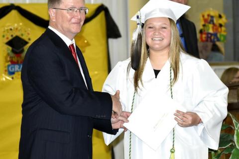 Graham-Dustin seniors receive diploma from Robert Holt, School Board President