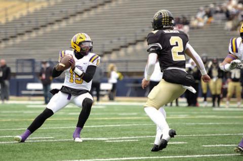 Quarterback Isaiah Drake drops back to pass.