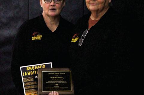 CALVIN SCHOOL SUPERINTENDENT JERAD WINNINGHAM recently presented a dedication plaque to Gina Simmons, wife-widow, &amp; Ginger Simmons, daughter, of the late James Simmons, School Board Member for 20 years. Photos by Felisha Ring