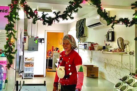 WETUMKA SENIOR CENTER’S NEW HEAD COOK, Tracy Hughes, decked out in her smartest Christmas fine.r y Photo Courtesy of Byron Tapley