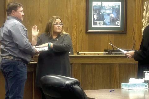 Anna Jett sworn in as Hughes County Treasurer by Judge Trisha Smith. Anna’s husband, Jimmie, held the Bible for her swearing in ceremony. (Photo courtesy of Angela Brooks)