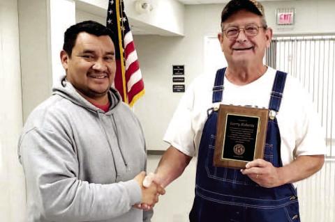 Larry Roberts recently retired from the Wetumka Kiwanis Club. Eric Yahola (left), Kiwanis President is presenting Larry with a plaque honoring him for his 12 years of dedication to the local club.