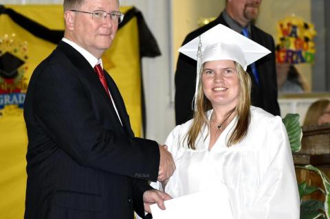 Graham-Dustin seniors receive diploma from Robert Holt, School Board President