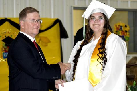 Graham-Dustin seniors receive diploma from Robert Holt, School Board President