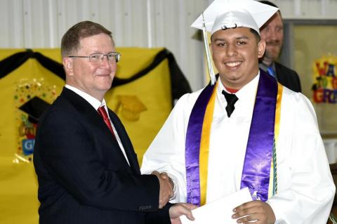 Graham-Dustin seniors receive diploma from Robert Holt, School Board President