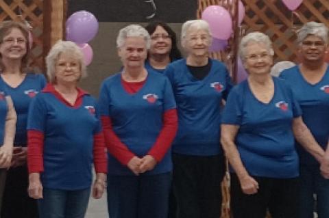 Red Hatters Royally Entertained by the Young at Heart Group