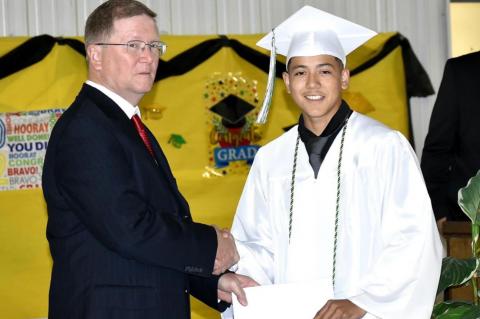Graham-Dustin seniors receive diploma from Robert Holt, School Board President